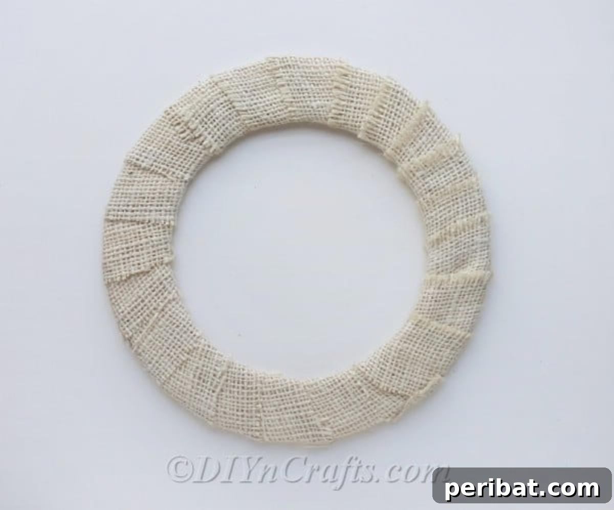 Cover wreath form with burlap to create a rustic base