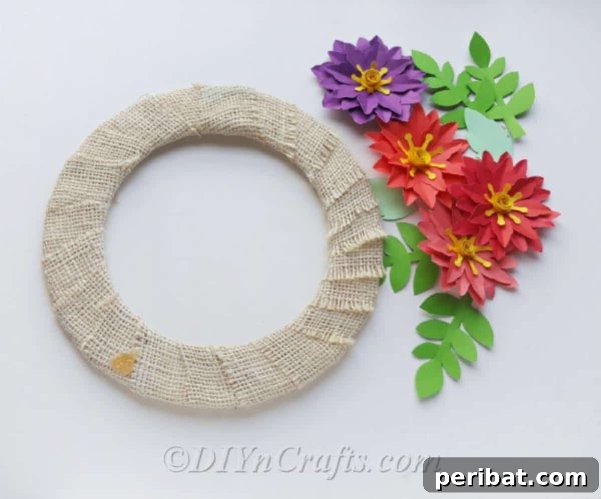 Use hot glue to attach flowers to wreath form for a strong bond