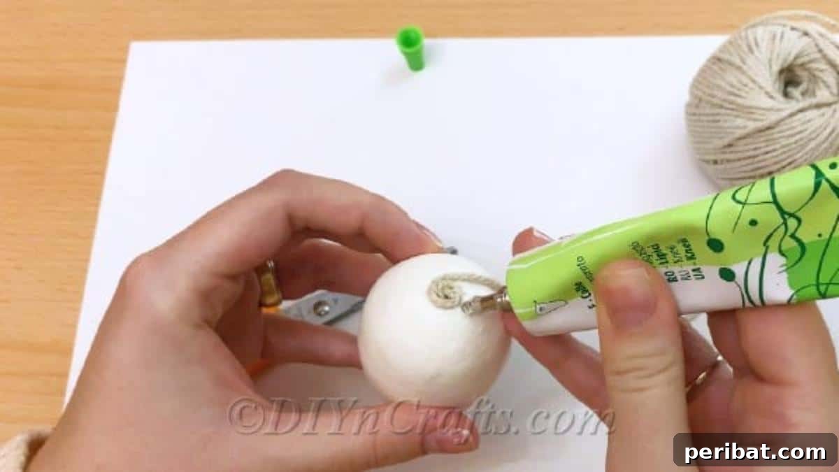 Handcrafted Rustic Glam Easter Eggs 6 Beginning to wrap twine around the egg, securing it with glue