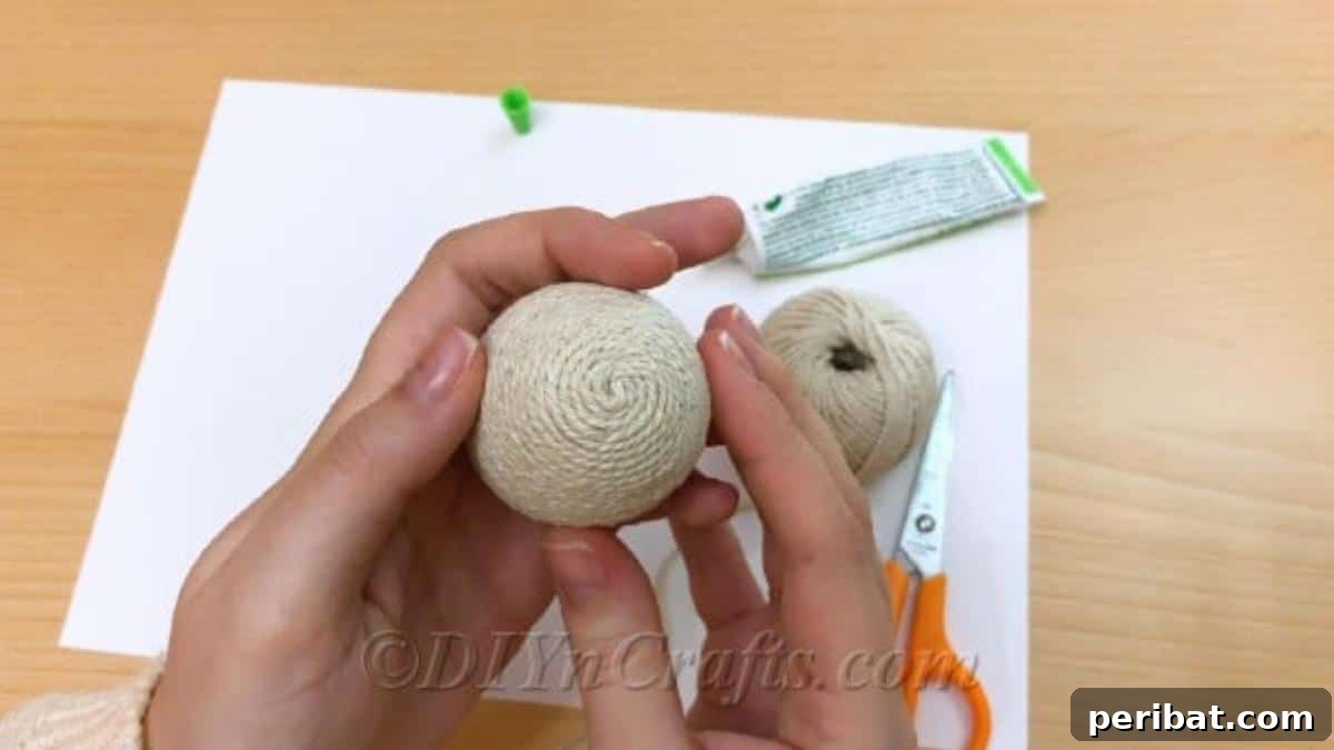 Handcrafted Rustic Glam Easter Eggs 7 Methodically covering the craft egg with twine, layer by layer, secured with glue