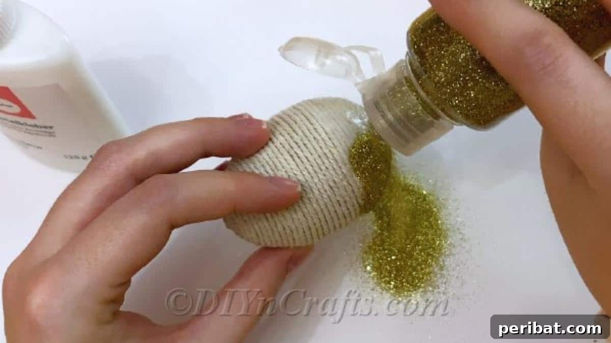 Handcrafted Rustic Glam Easter Eggs 9 Sprinkling fine glitter over the wet glue on the craft egg and allowing it to dry