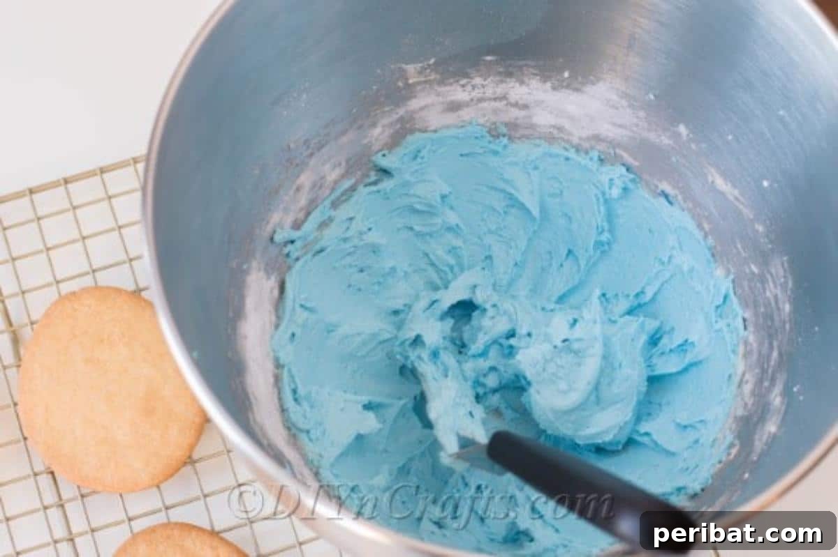 Mix butter, sugar and milk to make homemade buttercream 