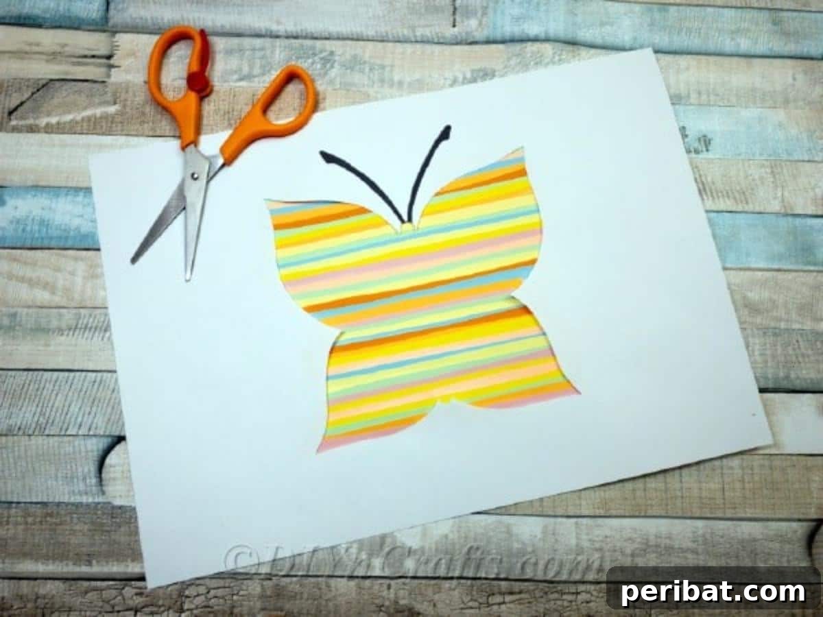 Springtime Flutter: Colorful Paper Butterflies for Little Hands 2 Vibrant paper butterfly craft made by kids, perfect for spring decoration.