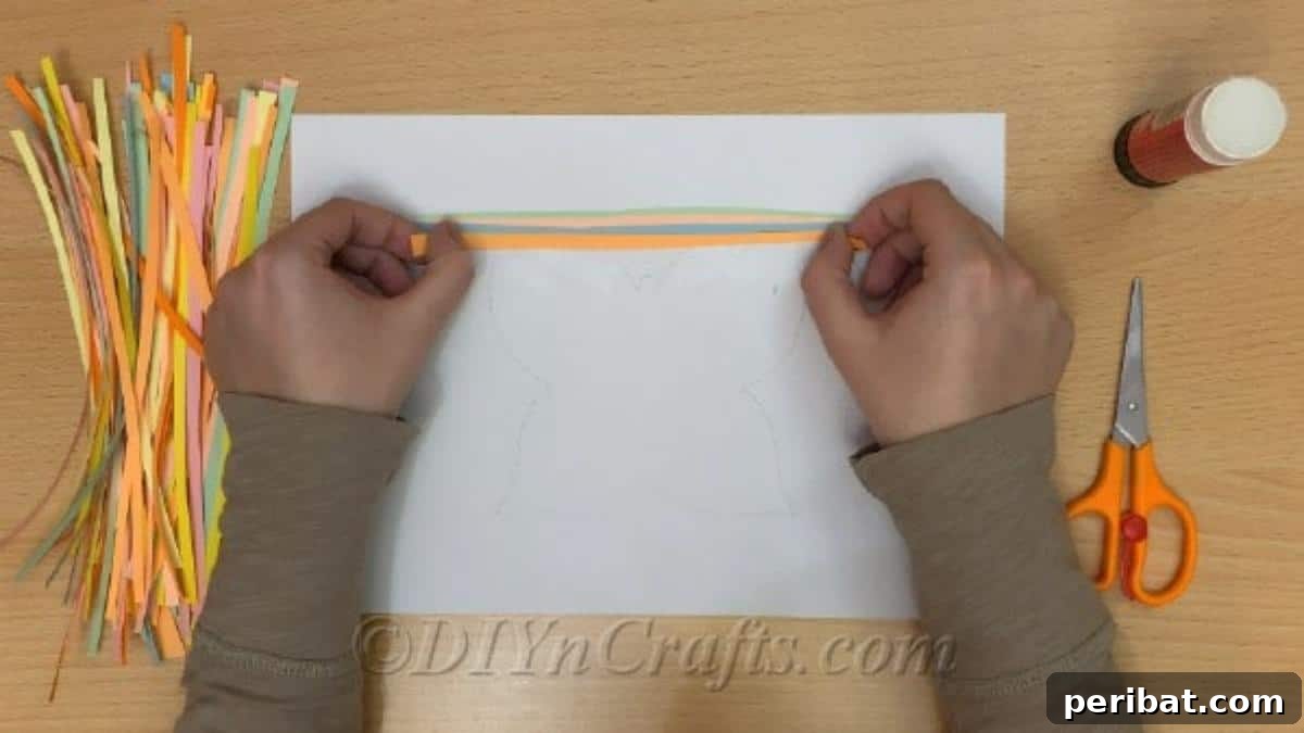 Springtime Flutter: Colorful Paper Butterflies for Little Hands 5 Applying colorful paper strips to a white sheet, beginning the base for the spring butterfly craft.