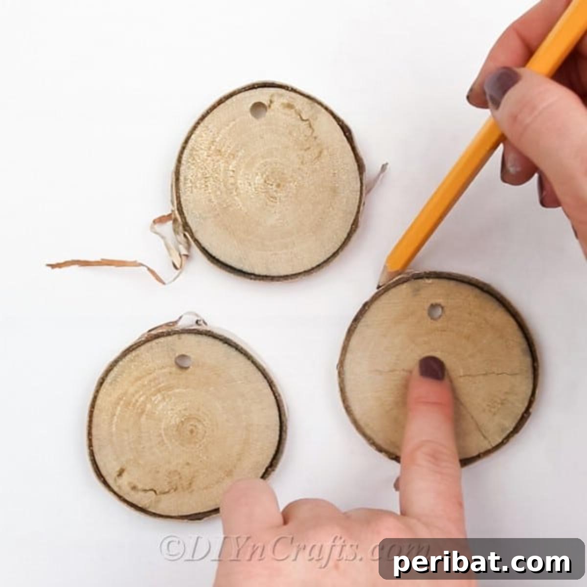 Farmhouse Hand Lettered Wood Slice Easter Decorations 4 Tracing the outline of a wood slice onto paper to create a template for hand-lettering