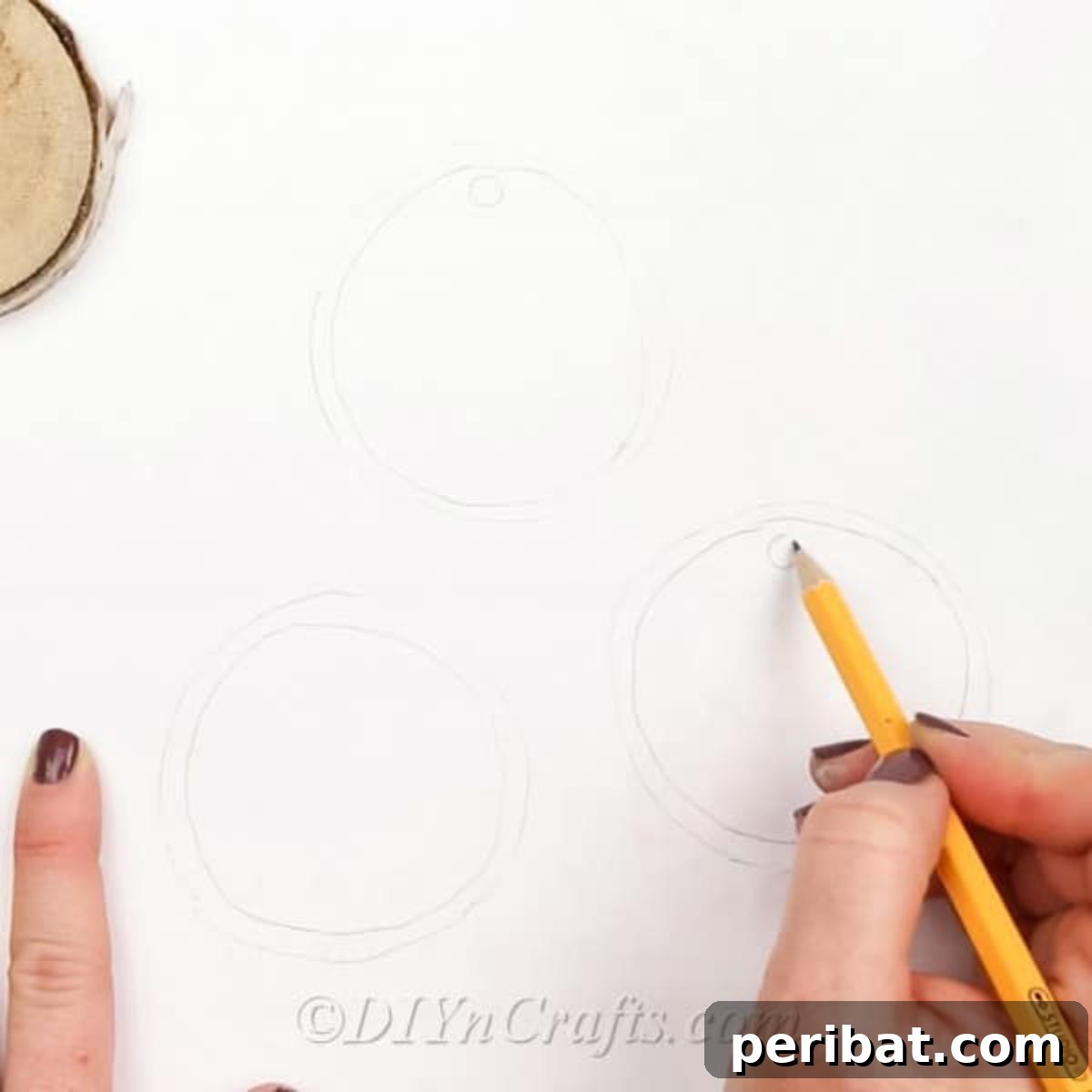 Farmhouse Hand Lettered Wood Slice Easter Decorations 5 Drawing an inner border on the paper template to guide the paint application on wood slices