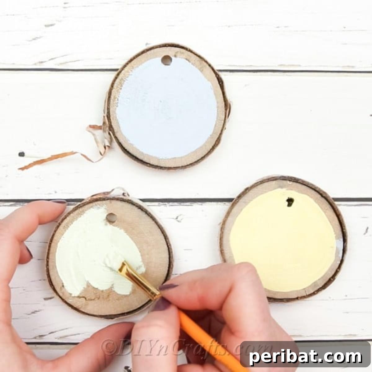 Farmhouse Hand Lettered Wood Slice Easter Decorations 7 Applying different colors of chalky paint to wood slices, leaving a natural wood border