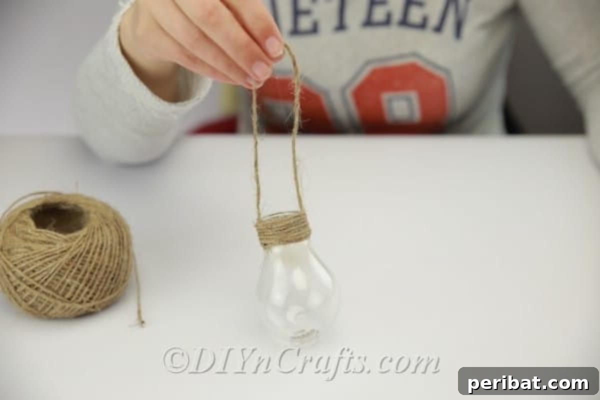 DIY Lightbulb Planter Perfect for Spring 12 Making a loop with twine to hang bulb planter