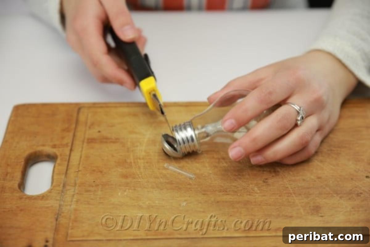 DIY Lightbulb Planter Perfect for Spring 8 Taking off the bottom portion of lightbulb