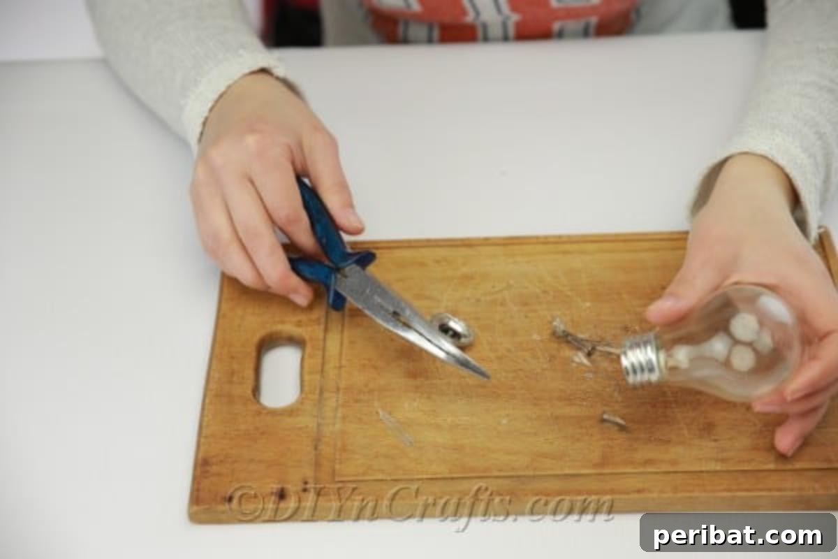 DIY Lightbulb Planter Perfect for Spring 9 Carefully cutting away bottom of the bulb