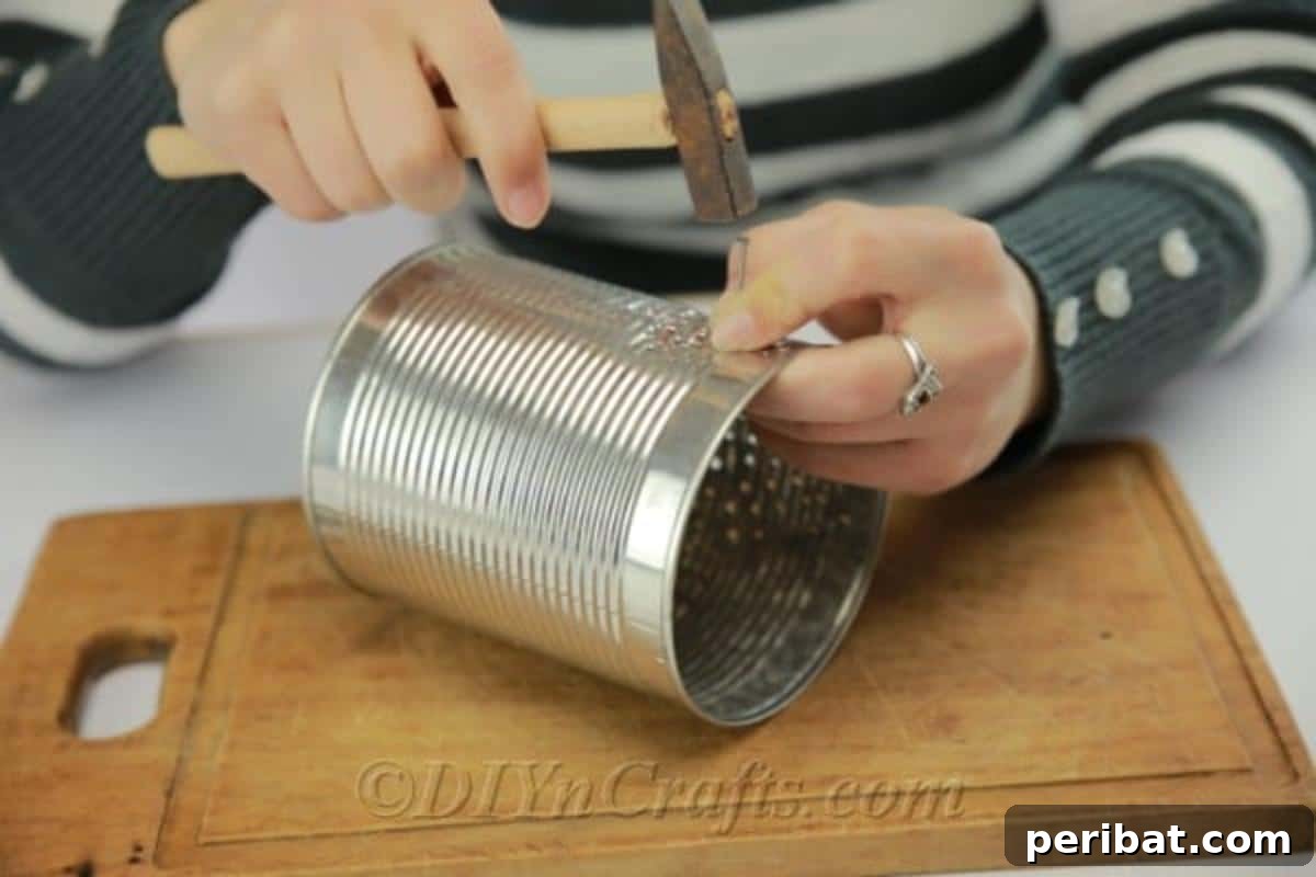 Craft Stunning Lights from Upcycled Tin Cans 11 A finished DIY tin can luminary with a candle placed inside, ready to cast its beautiful glow.