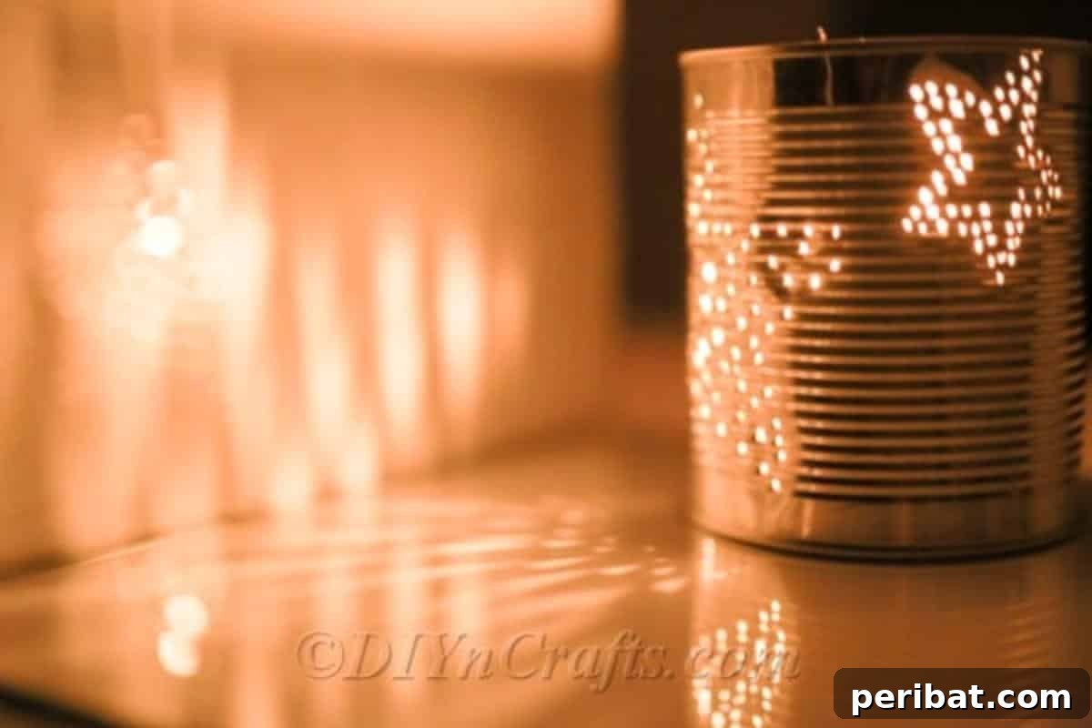 Craft Stunning Lights from Upcycled Tin Cans 3 Close-up of a tin can with a star-shaped hole pattern, ready for illumination as a DIY luminary.