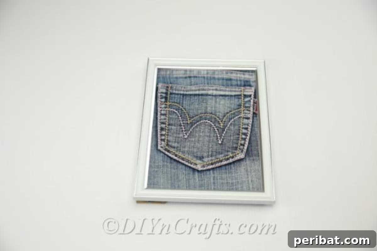 Close-up of the finished pen pocket in the frame, ready to hold pens