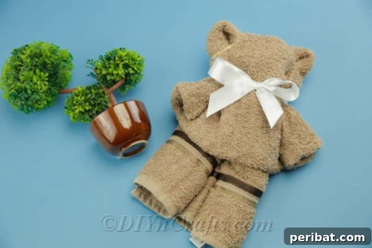 Craft a Cuddly Washcloth Bear 6 A washcloth teddy bear proudly displayed as a baby shower gift