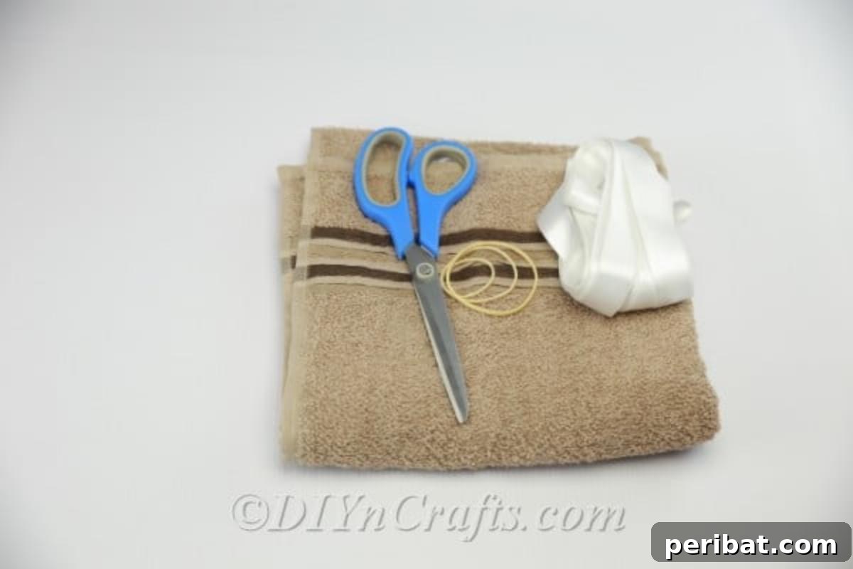 Craft a Cuddly Washcloth Bear 3 Supplies needed to make a DIY washcloth teddy bear, including a washcloth, rubber bands, and ribbon