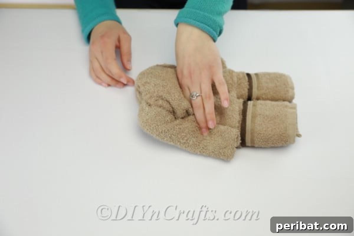 Craft a Cuddly Washcloth Bear 10 Washcloth folded and rolled to create a teddy bear's body structure