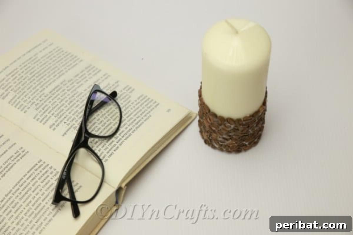 DIY coffee bean candle in progress, surrounded by newspapers for protection, showcasing the simplicity of this home decor project.