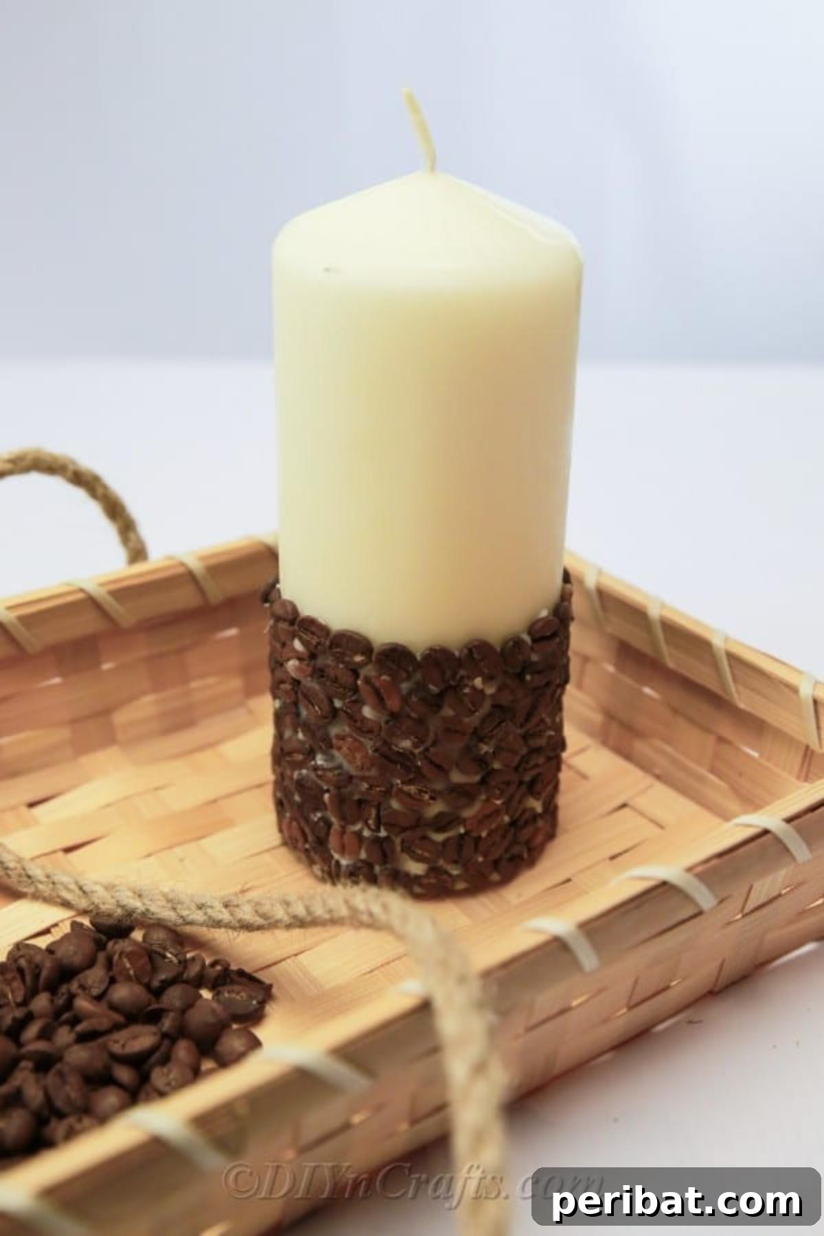 A rustic coffee candle in a decorative tray, highlighting the cozy and natural aesthetic of coffee bean candles as unique home decor.