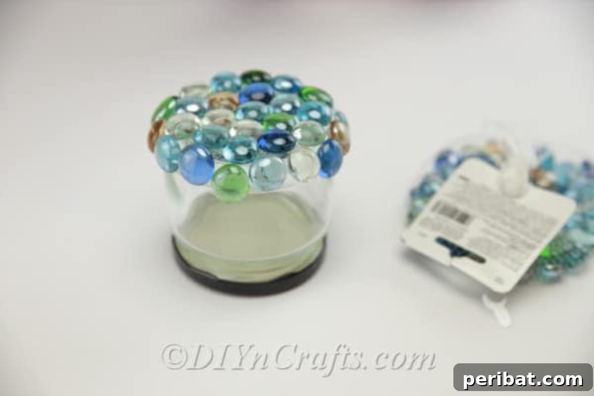 DIY Enchanted Garden Jars 9 Bottom of a glass jar covered in multicolored glass stones