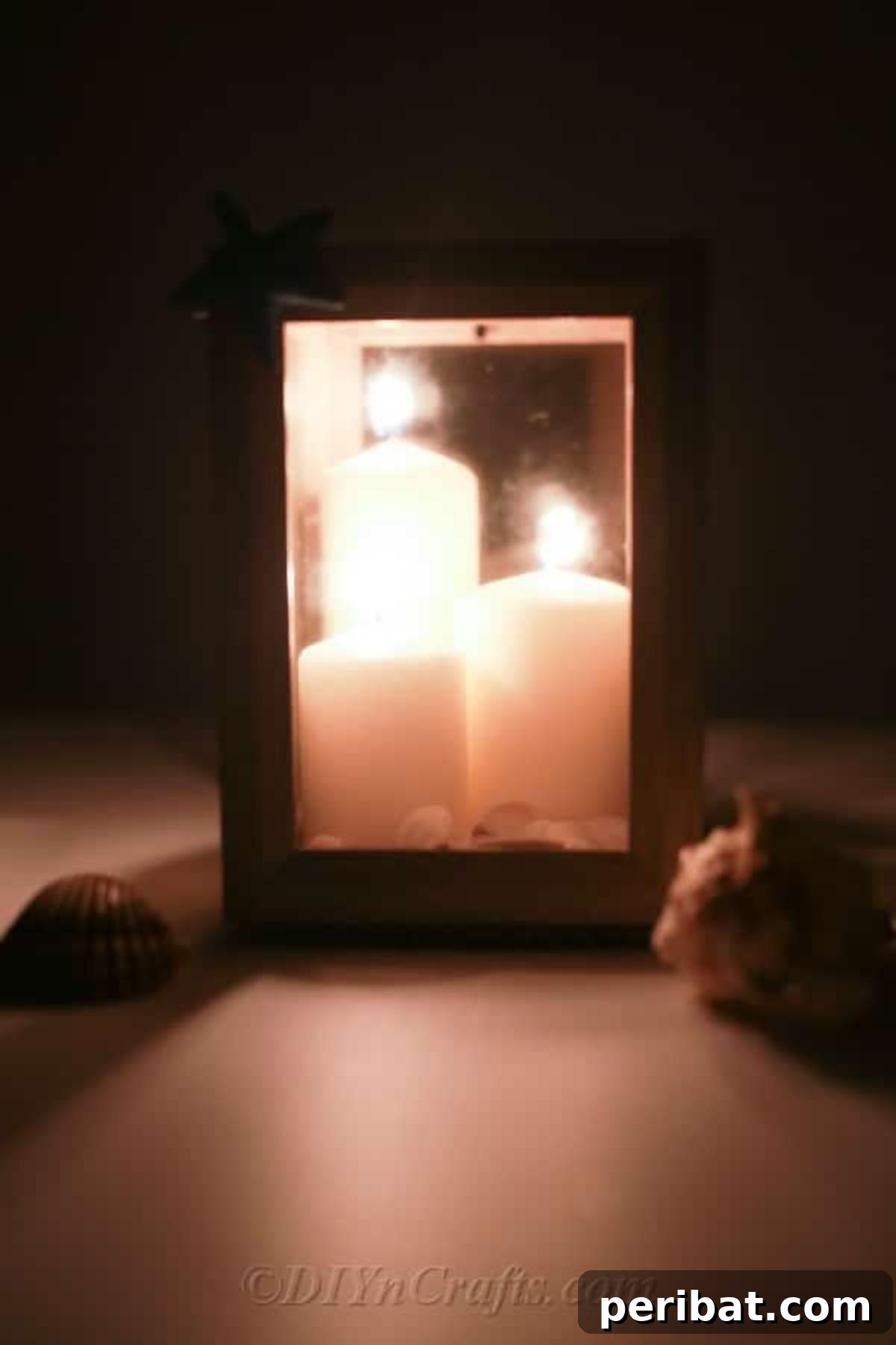 Picture frame lantern lit up with candles for cozy ambiance