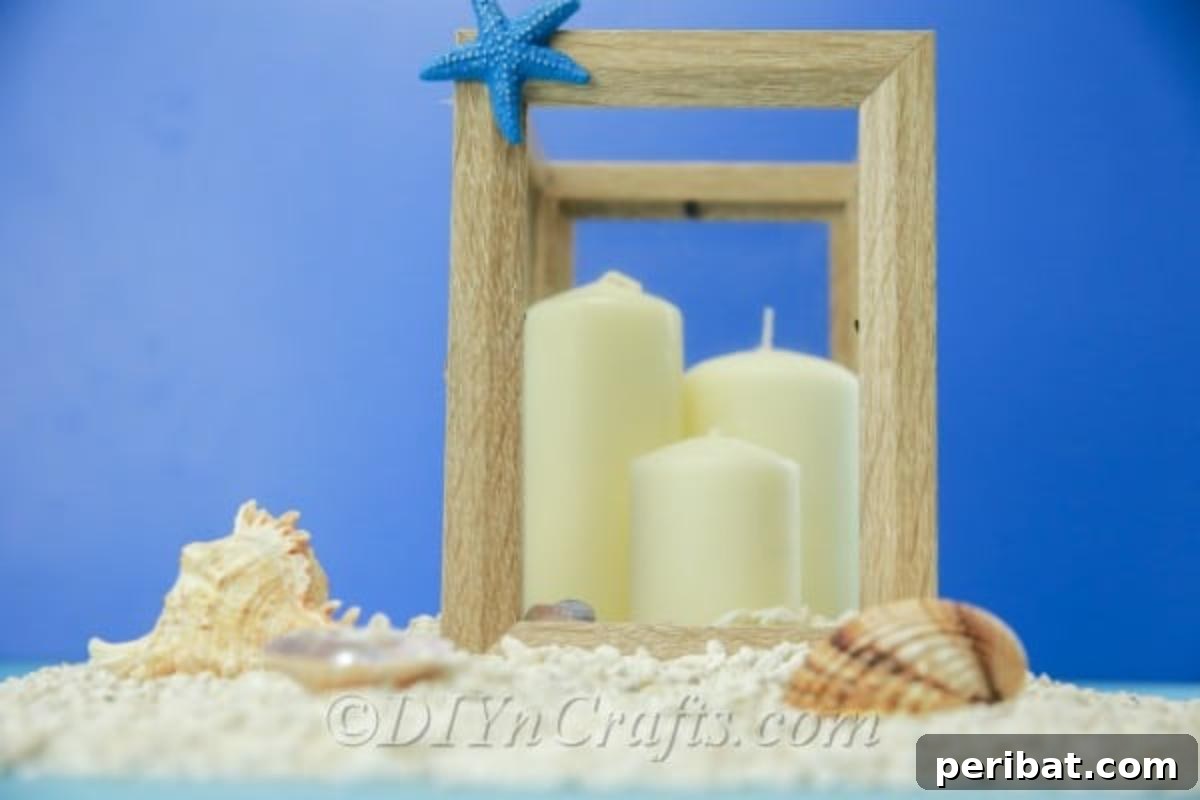 Picture frame lantern with seashells and candles