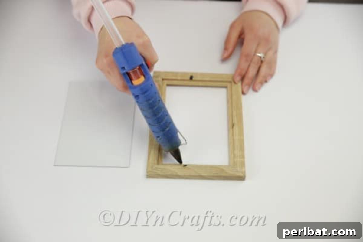 Gluing glass onto a picture frame securely