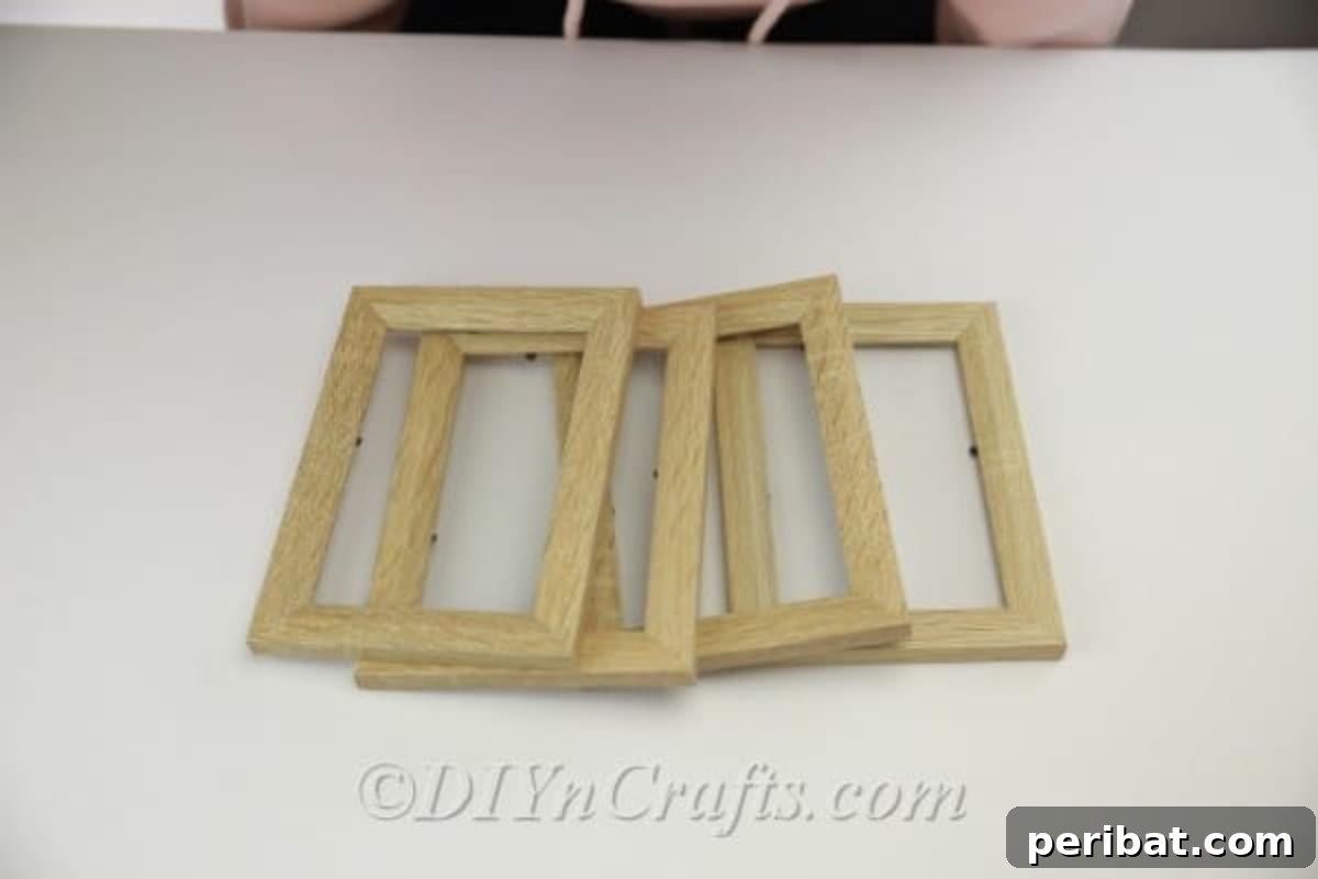 Four picture frames arranged for lantern construction