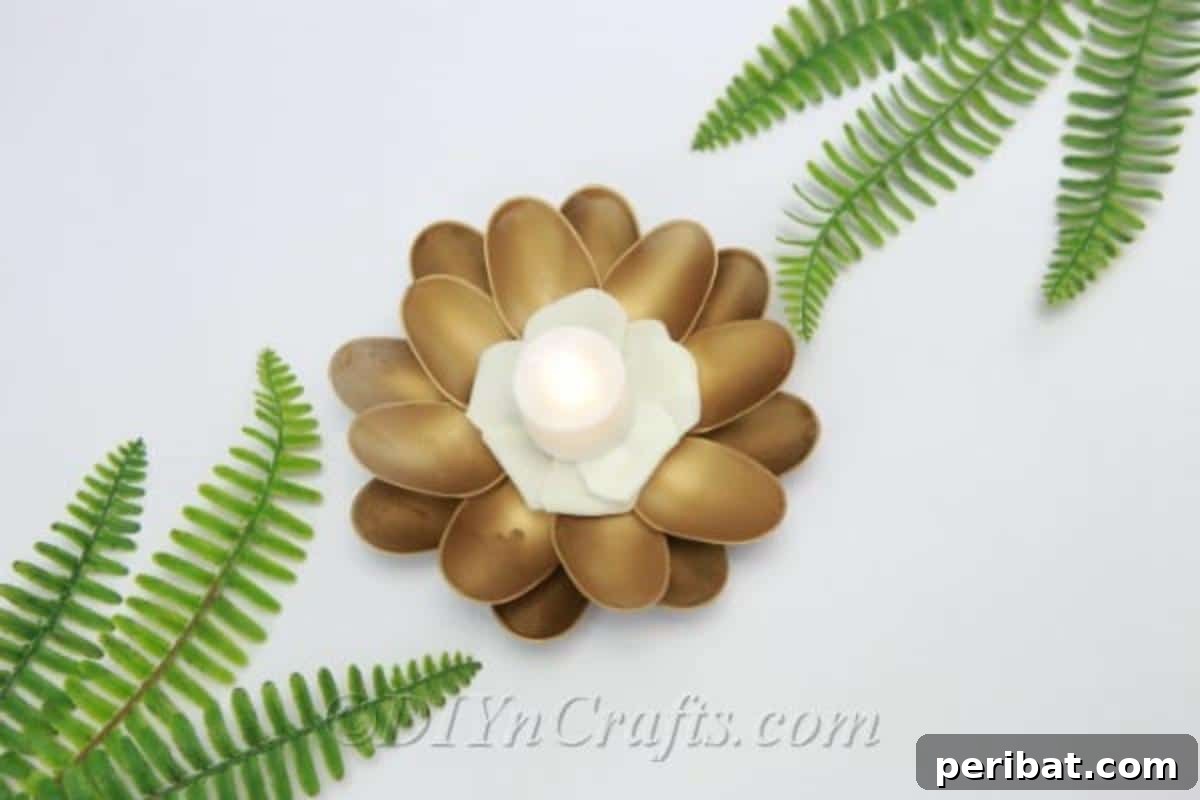 Glowing plastic spoon candle holder with LED candle