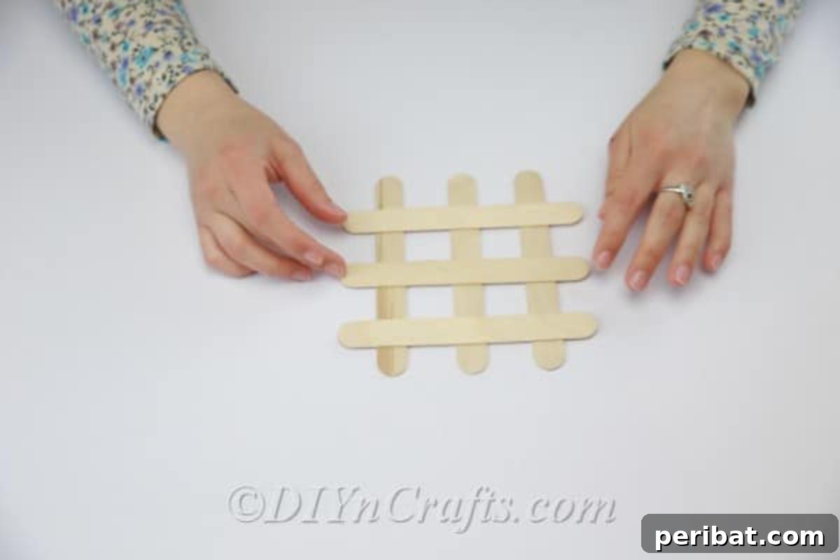 Stick-tacular Creations: 3 Crafts for Every Generation 13 Laying craft sticks down parallel to create a coaster base