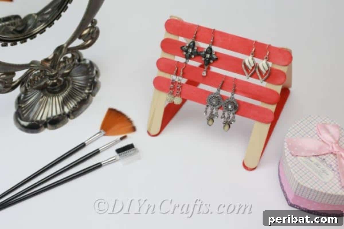 Stick-tacular Creations: 3 Crafts for Every Generation 4 Earrings organized on a handmade popsicle stick earring holder