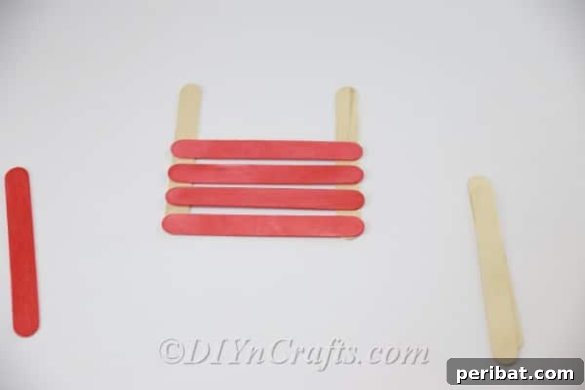 Stick-tacular Creations: 3 Crafts for Every Generation 7 Gluing colored popsicle sticks onto plain sticks to form an earring holder frame