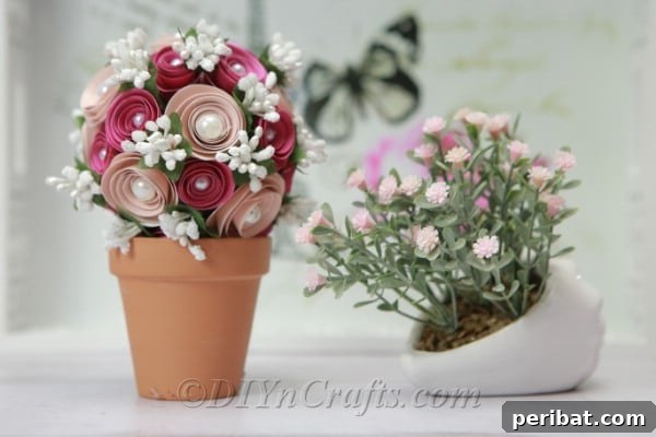 A finished decorative paper flower ball serving as an elegant desk decoration or a charming centerpiece for a small table.