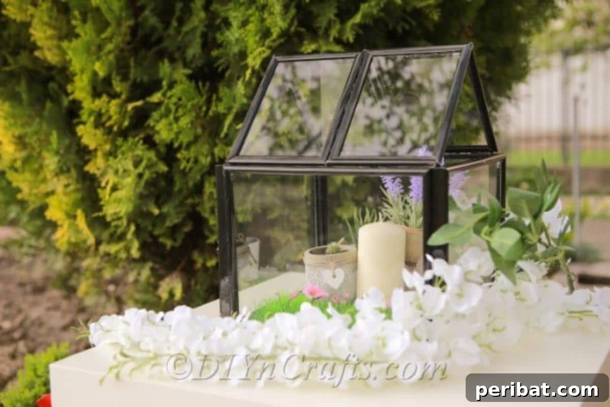 Repurpose Old Picture Frames Into A Delightful Mini Greenhouse 24 A beautifully decorated miniature greenhouse made from picture frames, featuring flickering LED candles inside, creating a warm ambiance.