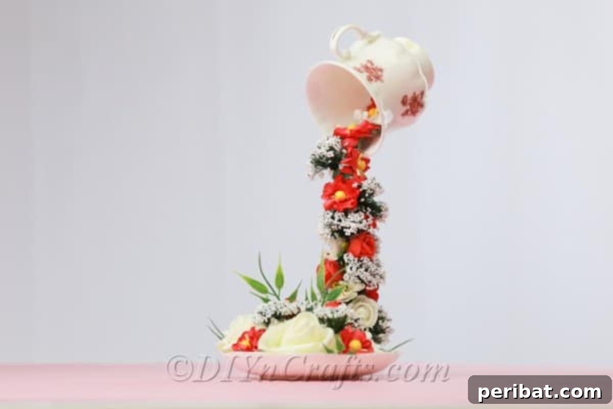 Craft a Magical Floating Teacup Ornament 2 Finished floating teacup and saucer adorned with colorful artificial flowers