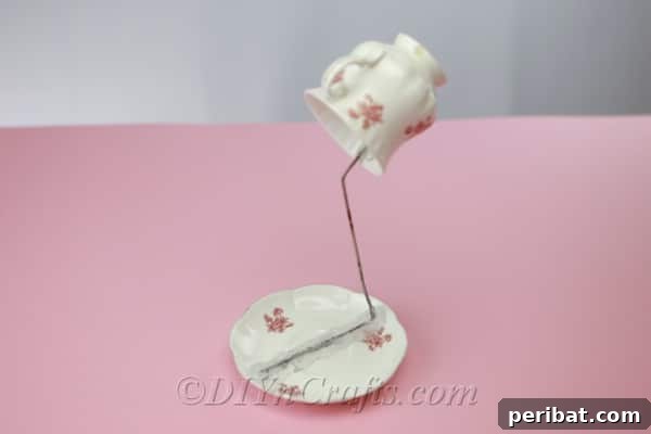 Craft a Magical Floating Teacup Ornament 10 Teacup and saucer with the wire framework in place before adding decorative flowers