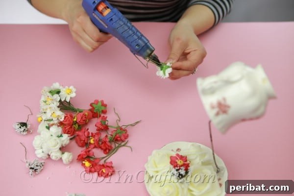 Craft a Magical Floating Teacup Ornament 13 Continuing to add and glue flowers to fully cover the wire and create a lush display