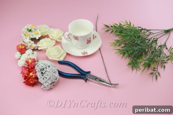 Craft a Magical Floating Teacup Ornament 5 Supplies needed for DIY floating teacup craft including teacup, saucer, flowers, and glue gun