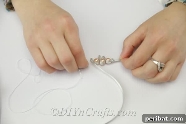 Crafting a Pearl and Ribbon Bracelet 9 Sewing pearls into the satin ribbon