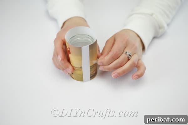 Taping a photo to the outside of an empty jar