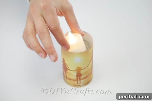 Placing a candle inside a photo covered jar