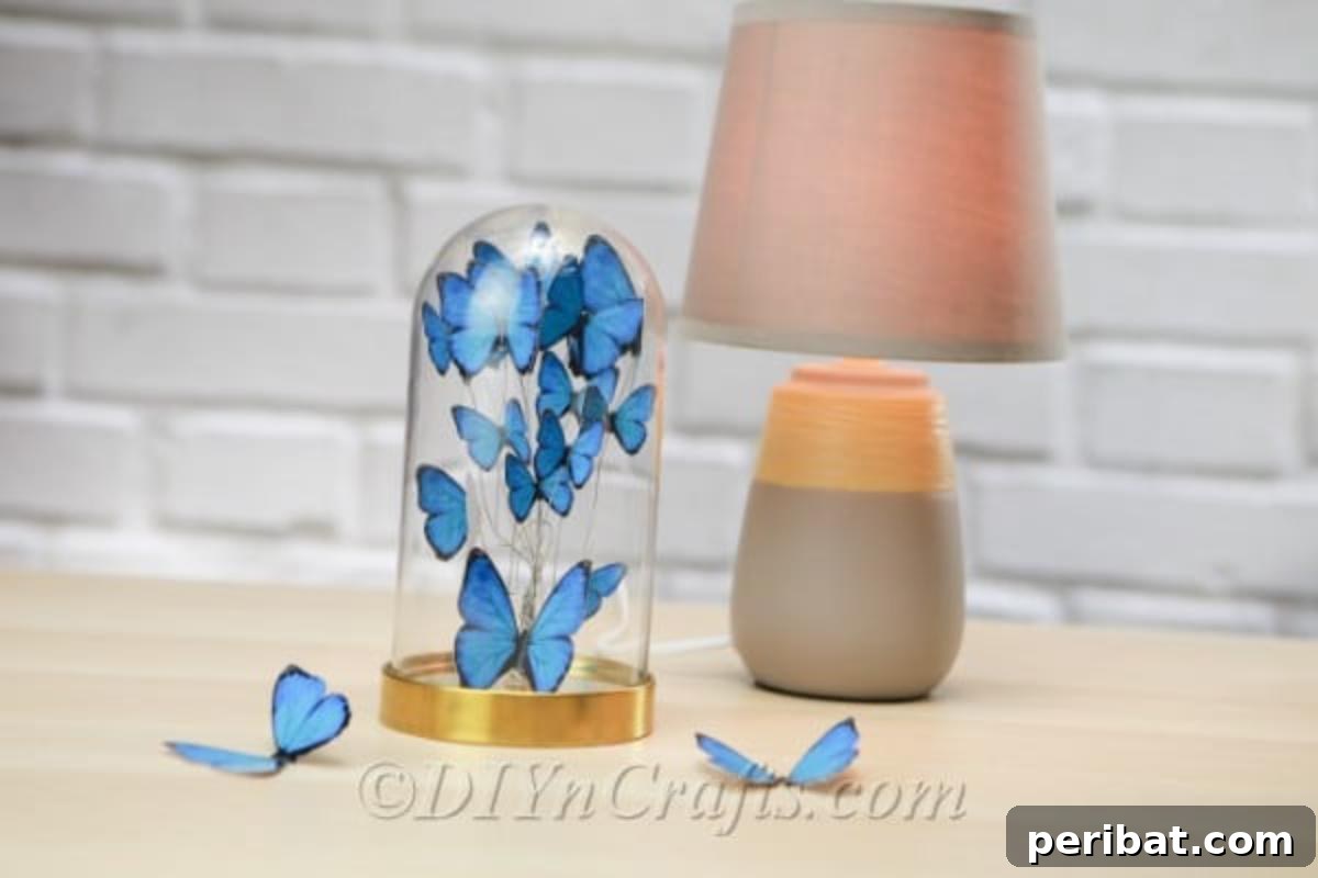 Crafting an Enchanting Butterfly Jar Terrarium 3 A close-up view of a DIY butterfly terrarium, showcasing the intricate details of the blue paper butterflies inside the jar.