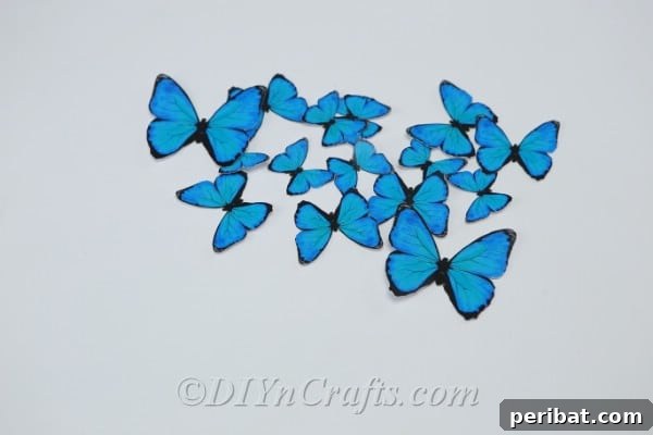 Crafting an Enchanting Butterfly Jar Terrarium 9 A collection of vibrant blue paper butterflies, ready to be arranged inside the jar for the terrarium.
