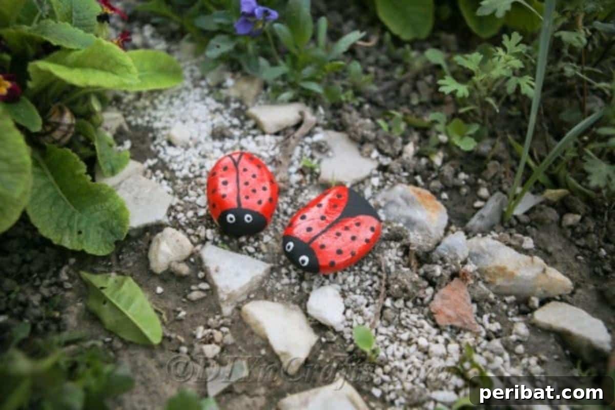 Whimsical Ladybug Stone Art 2 Painted ladybug stones on a garden pathway.