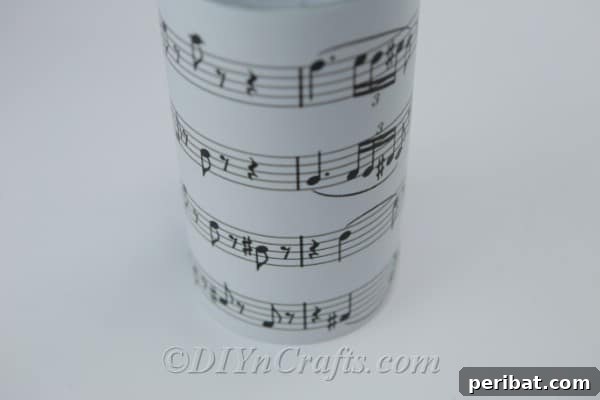 Trimming the sheet music to fit the jar perfectly