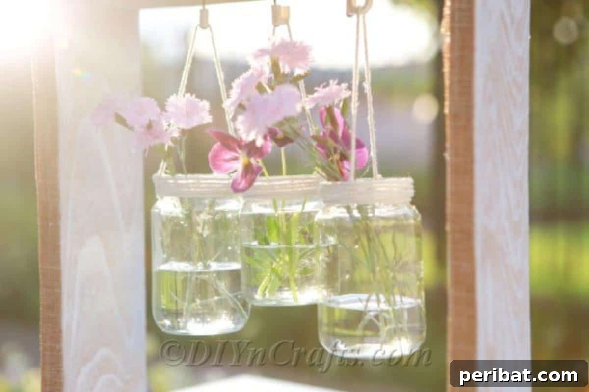 Close-up of a rustic wooden box, freshly painted and prepared to hold hanging glass jars, emphasizing the texture and repurposed nature of the material.