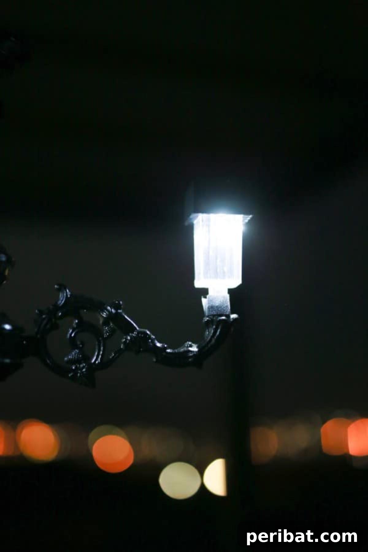 A single solar light glowing softly at night, ready for integration into a DIY chandelier.
