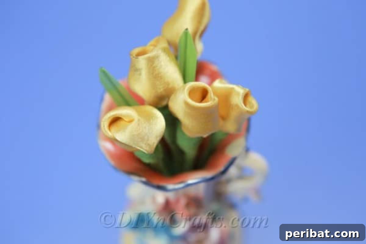 A charming arrangement of yellow satin tulips presented in a decorative vase, ideal for interior decor.