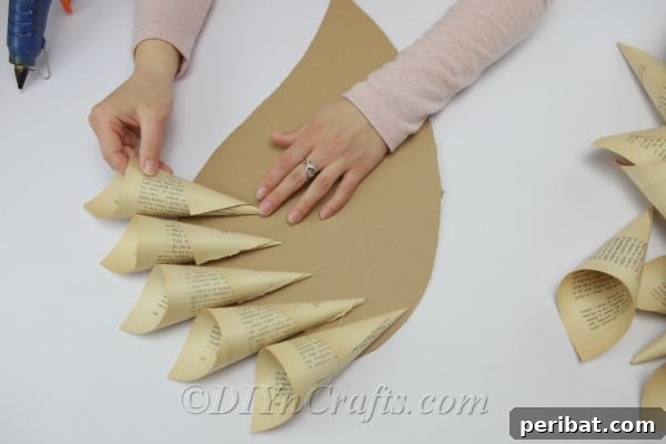 Literary Angel Wings Decor 13 Attaching book page cones to a cardboard wing base