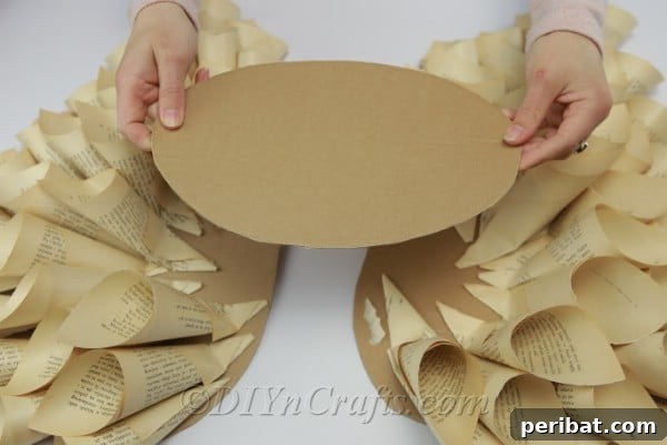 Literary Angel Wings Decor 14 An oval shape cut from cardboard for the center of the wings