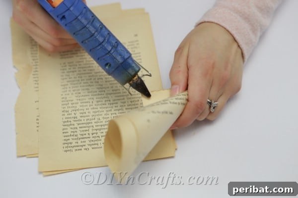 Literary Angel Wings Decor 9 Gluing down ends of book page cones to secure them